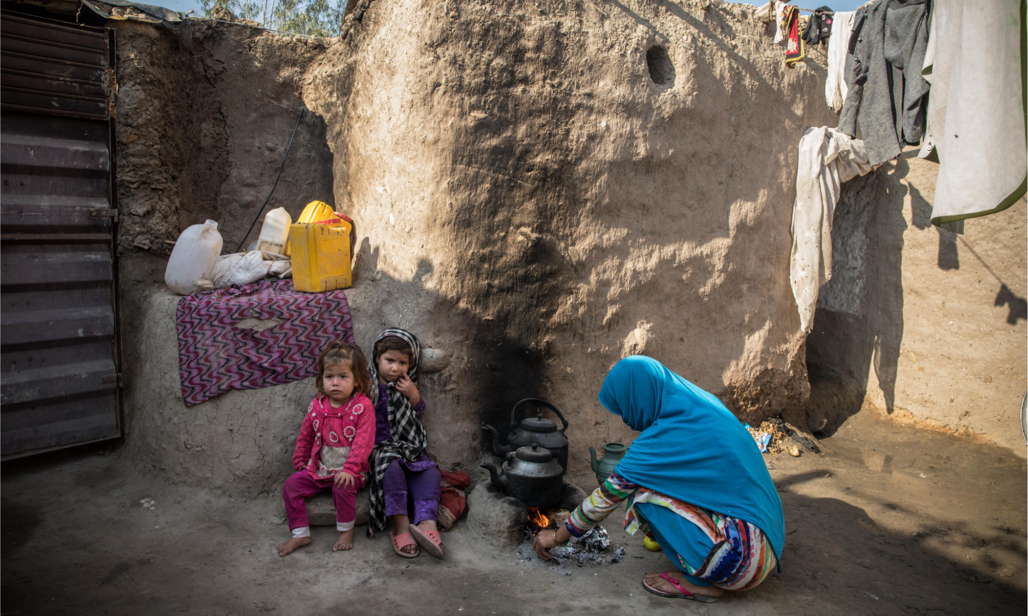 Family in Afghanistan preparing tea.